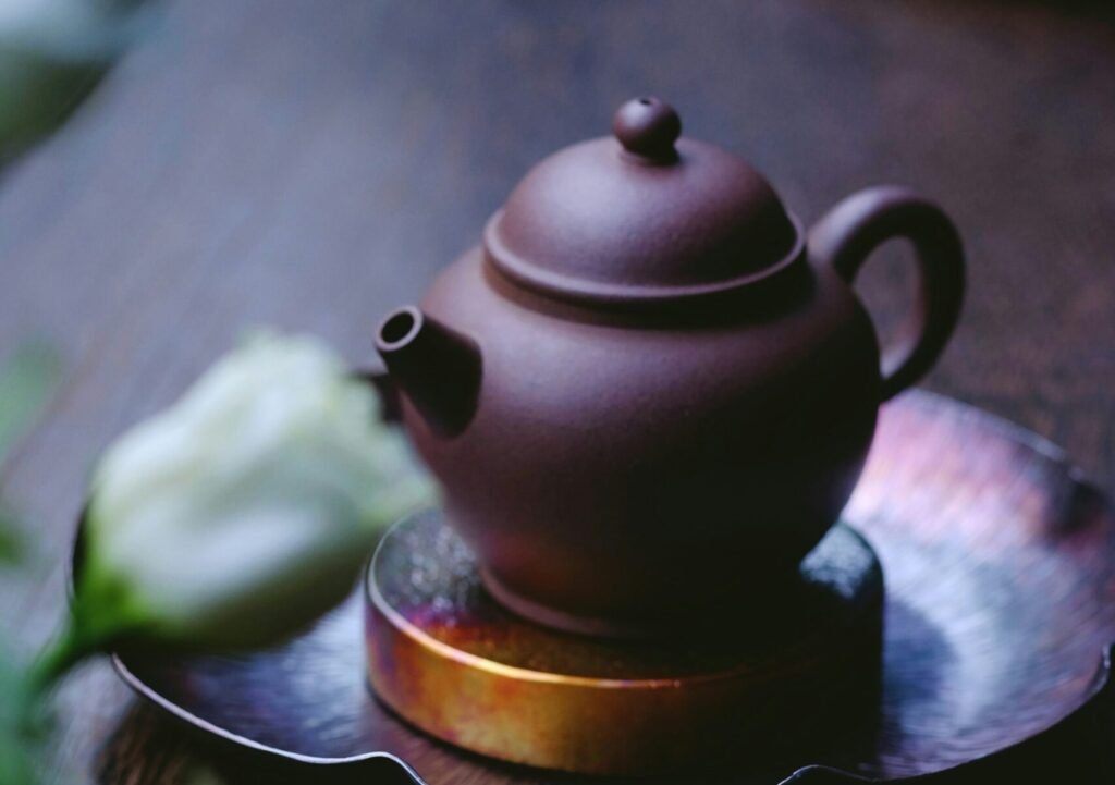 brown kettle on saucer